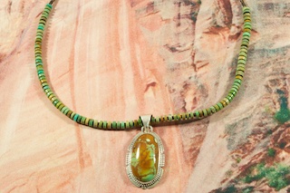 Genuine Manassa Turquoise set in Sterling Silver Pendant on a Manassa Turquoise Necklace. Sterling Silver Beads and Clasp. Created by Navajo Artist Phillip Sanchez. Signed. This Turquoise is also referred to as King�s Manassa Turquoise. The Manassa Turquoise mine is located in Manassa, Conejos County, Colorado.